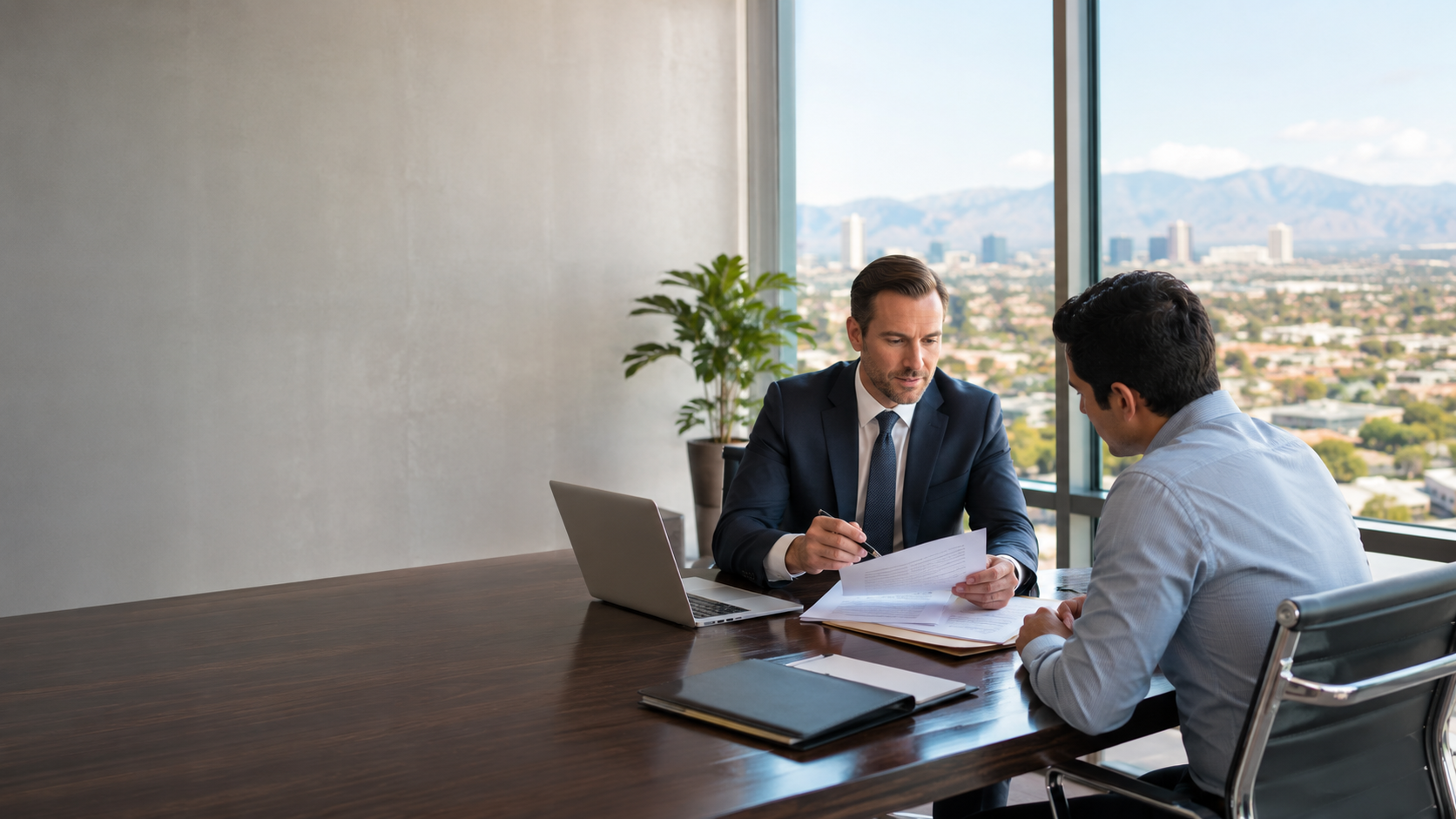 Corporate formation attorney reviewing business documents with a client in Henderson, NV